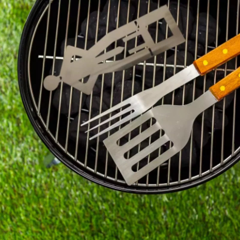 Original Grill Pal holder lying flat beside barbecue utensils